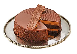 Metro Swiss Chocolate Truffle cake with chocolate pieces on top and chocolate crumbs around the sides
