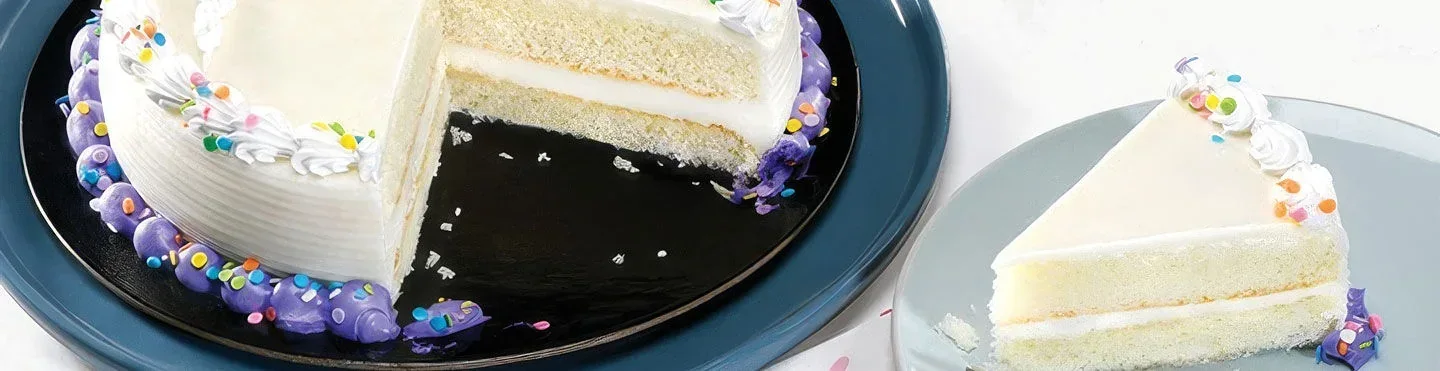 A Sobeys celebration cake with a slice removed to show its layers
