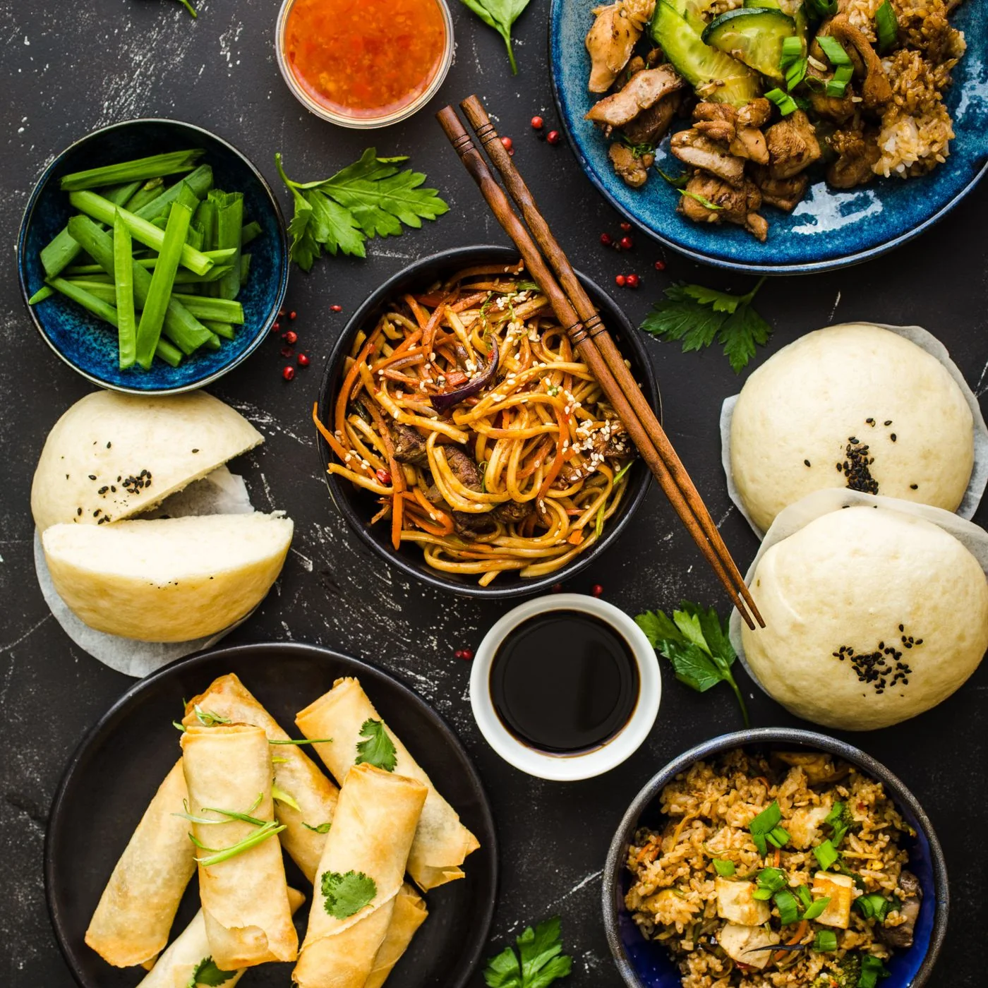 Buns, noodles, vegetables and other dishes in Rol San’s merchant photograph