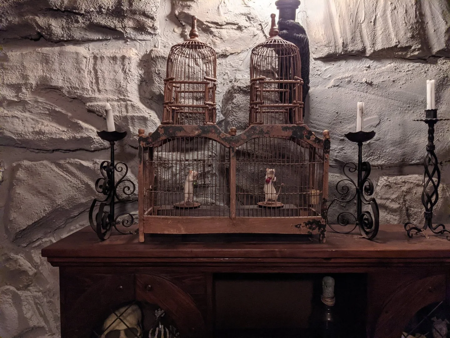 Birdcages and small props in a Looking Glass Adventures game space