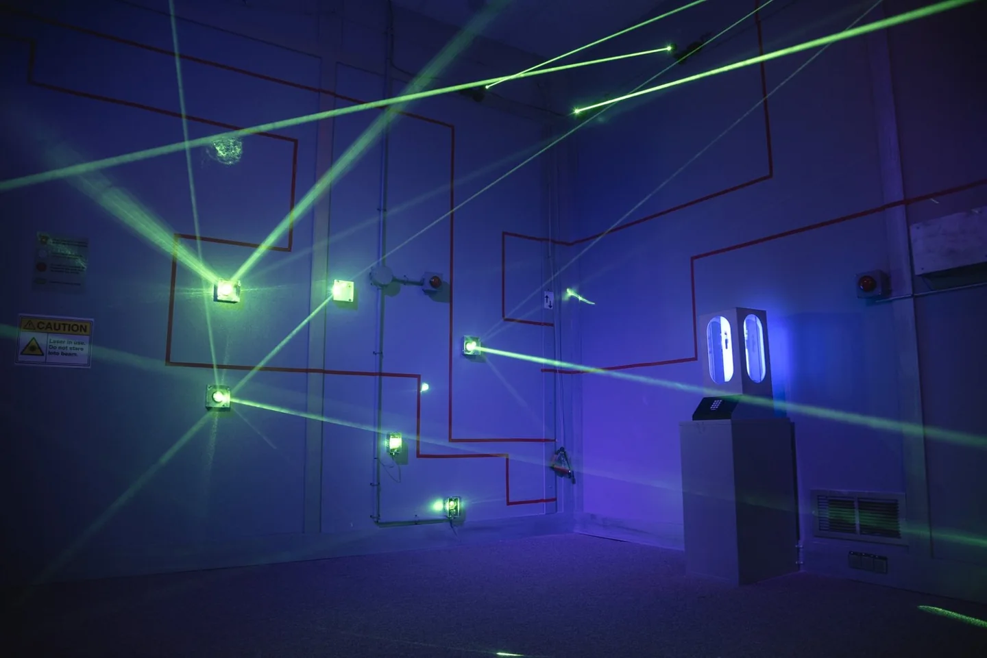 Blue light and lasers in a Looking Glass Adventures room