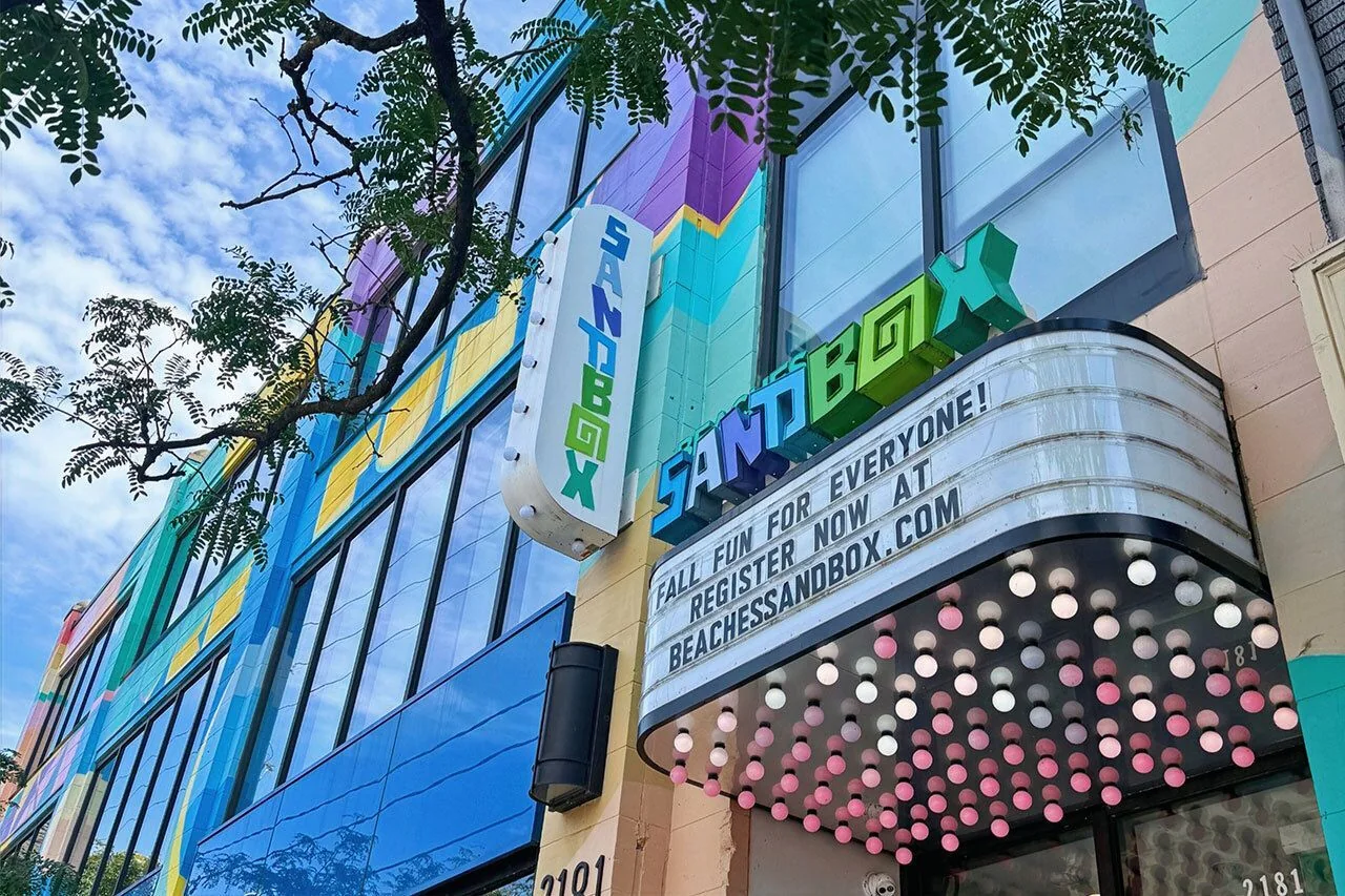 Bright painted facade of Beaches Sandbox on Queen Street East