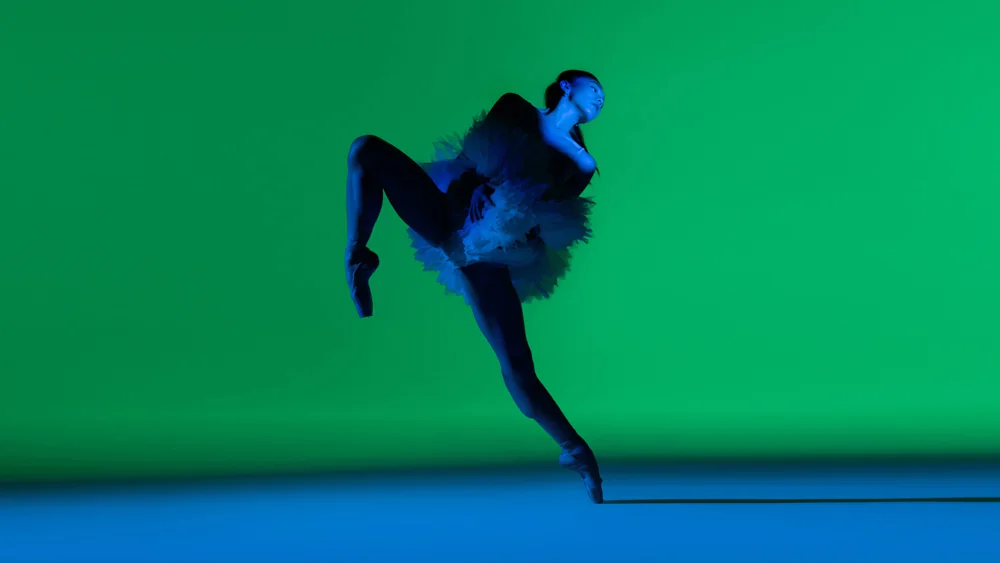 A ballet dancer leaping on stage