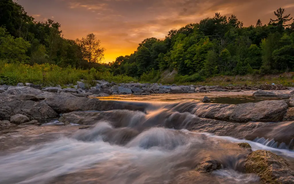 Highland Creek flowing over rocks at Morningside Park