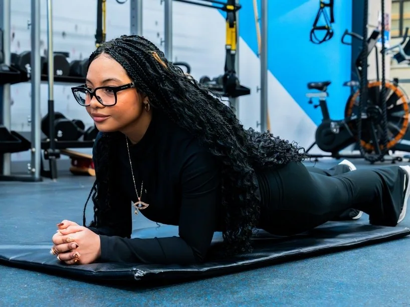 A TMU student working out in the gym