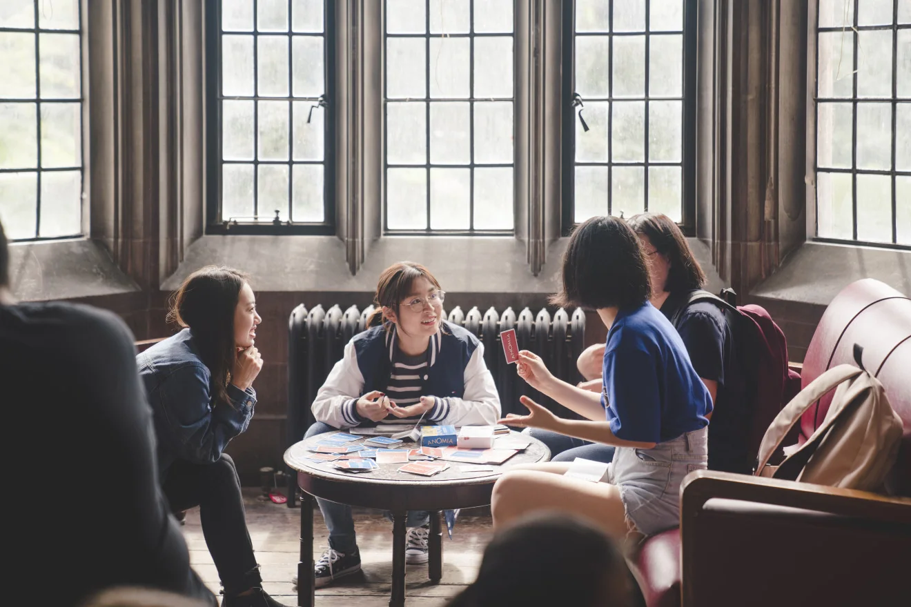 Students gathered around board games in the Hart House Reading Room