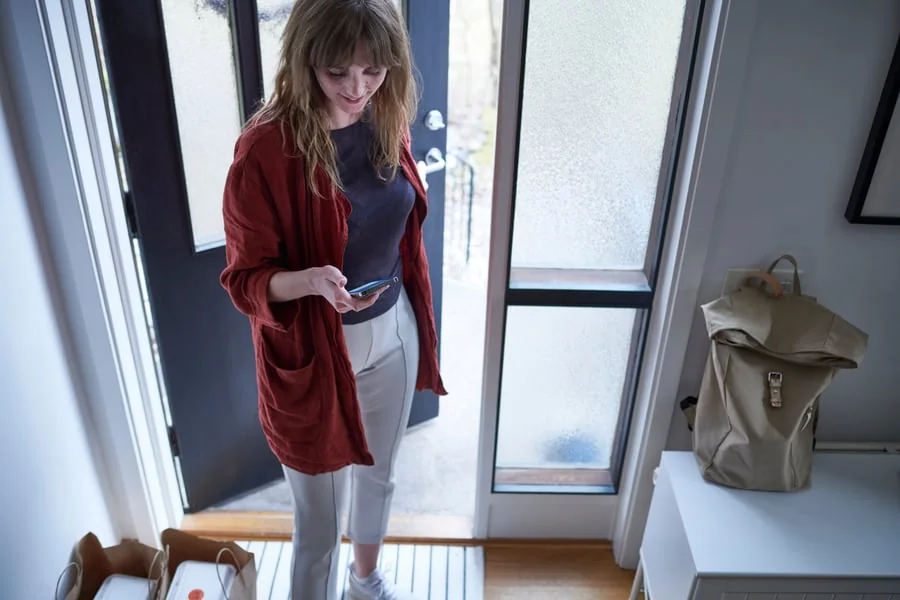 A woman waiting for a furniture delivery