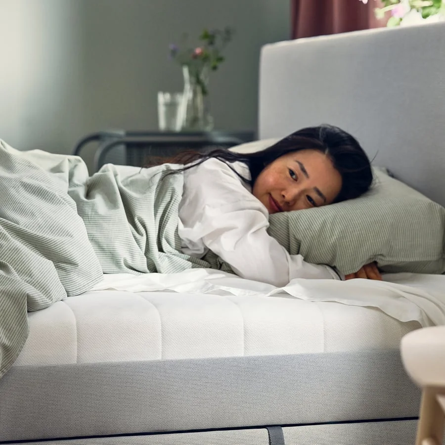 A person trying a mattress