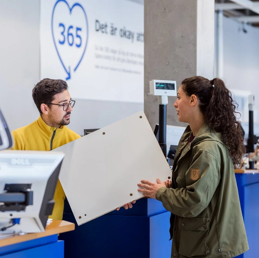 A customer speaking with IKEA staff