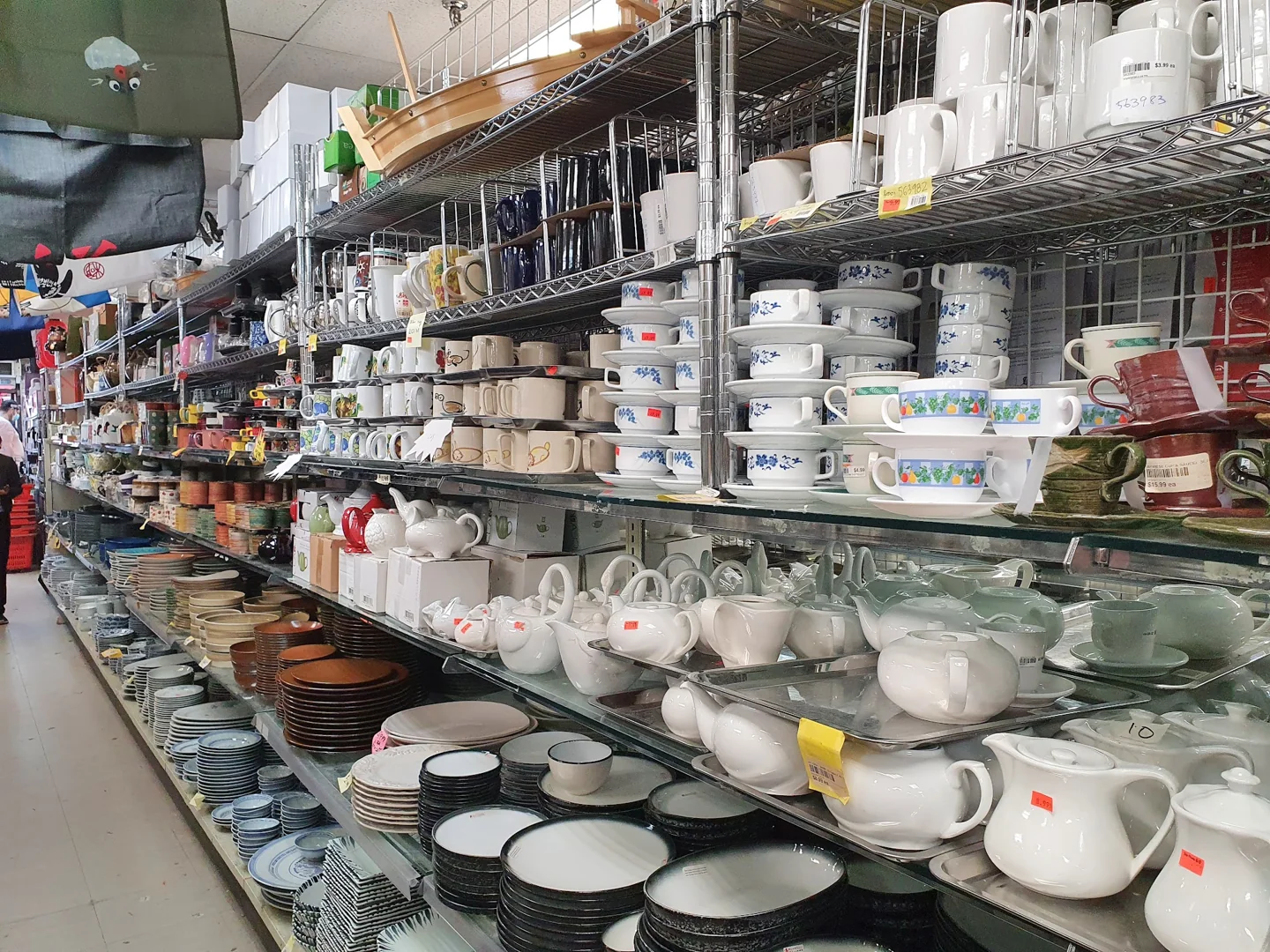 Shelves of bowls, cups and teapots at Tap Phong