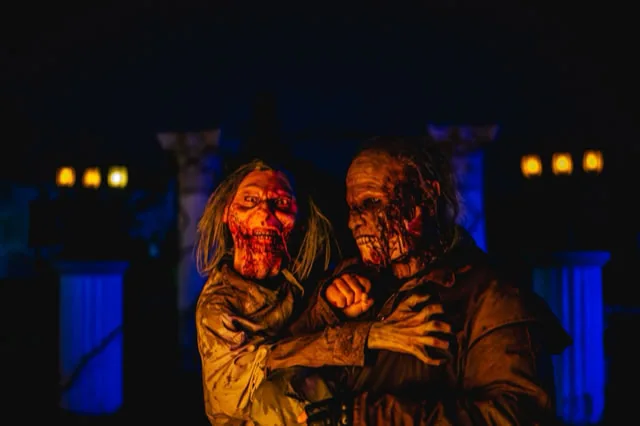 Two costumed horror characters at Fear Farm