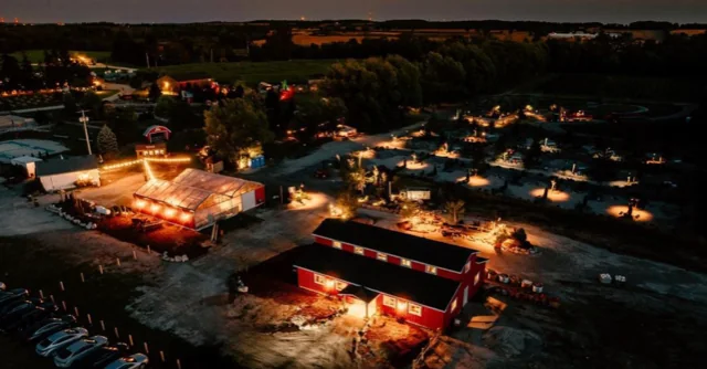 Fear Farm buildings and parking seen from above at night