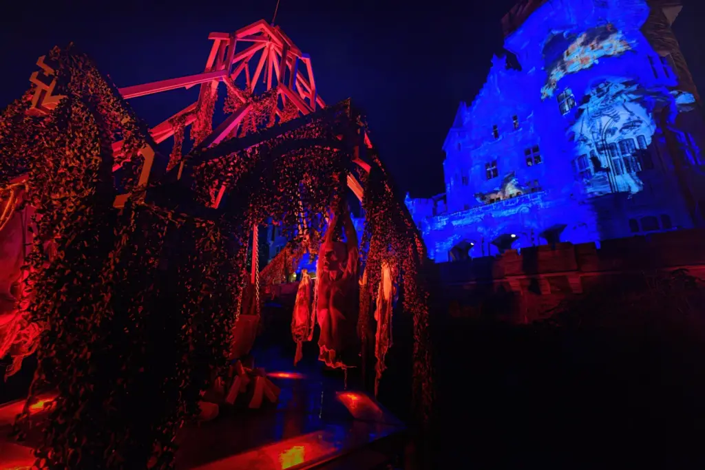 A lit outdoor scene with Casa Loma behind it