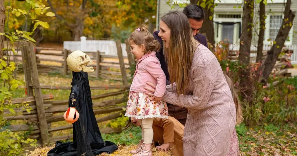 A family enjoying a daytime Halloween activity at Black Creek