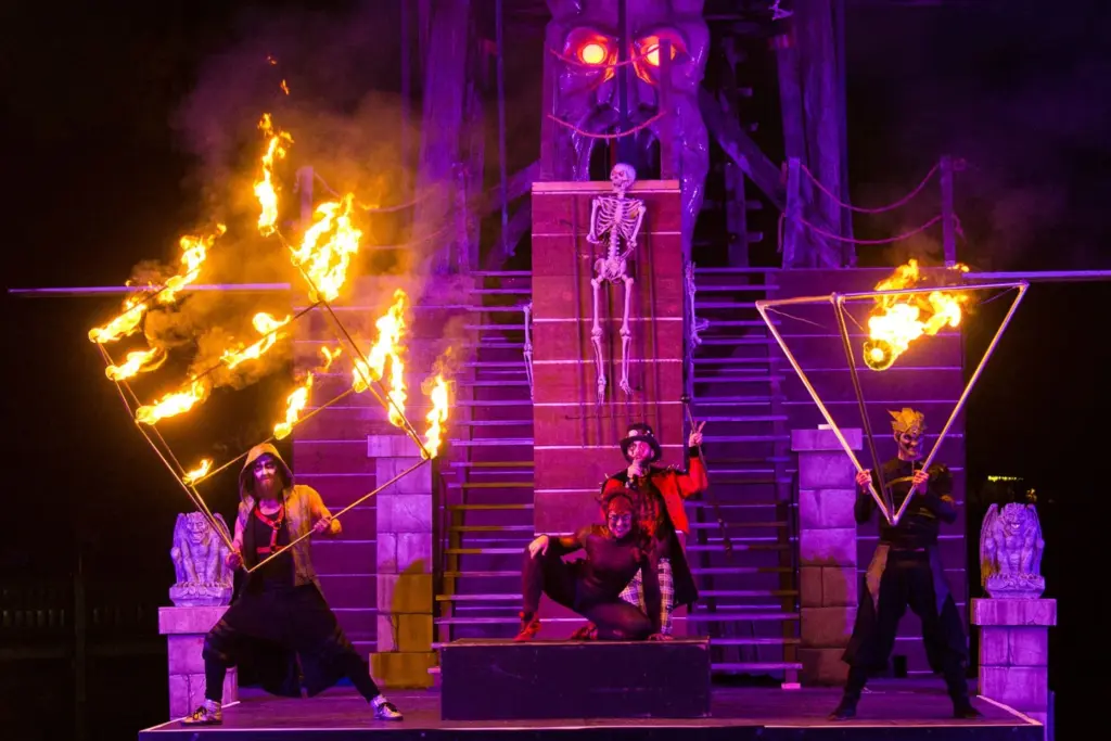 Fire performers on a lit stage at Wonderland
