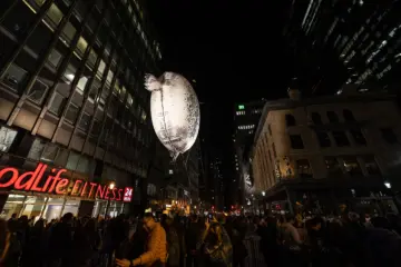 Avataq floating above a crowd on Yonge Street during Nuit Blanche 2022