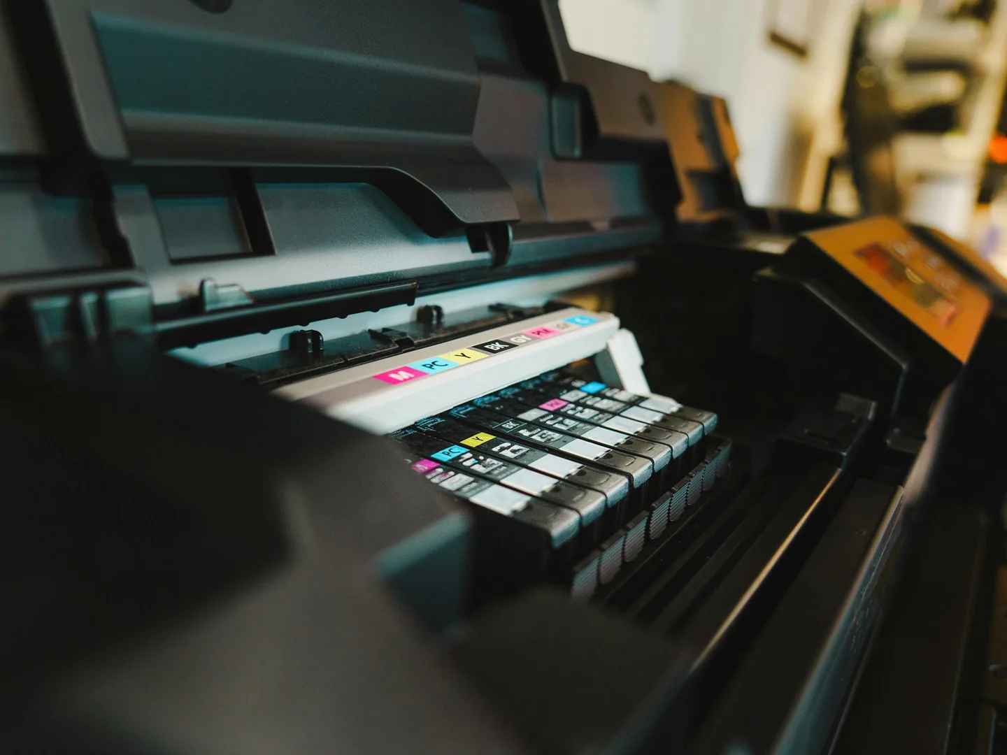 An industrial printing press with colour controls and printed output