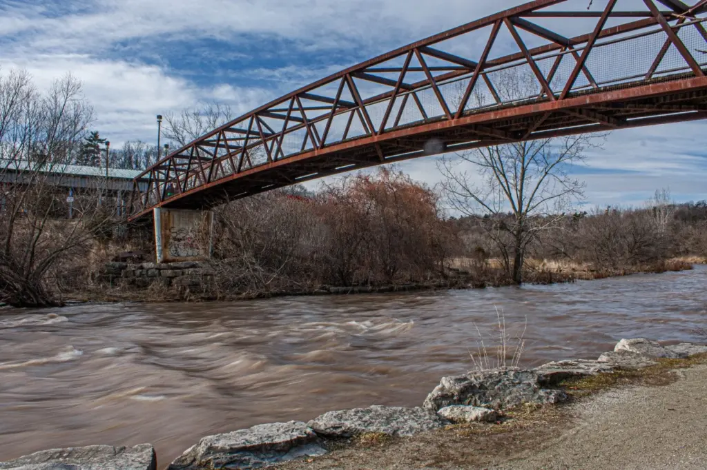 Pedestrian bridge over the Credit River at Erindale Park, with bare trees along the banks