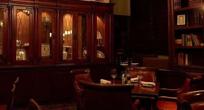 Wood-panelled dining room at The Keg Mansion