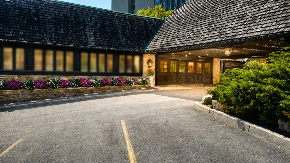 The covered driveway and stone entrance at Old Mill Toronto