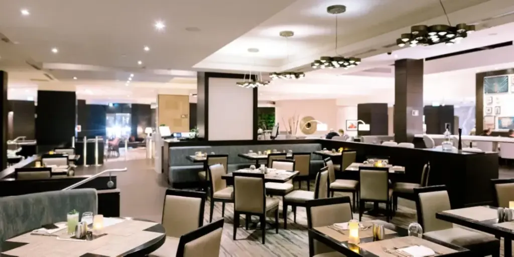 Set dining tables inside Seasons Restaurant