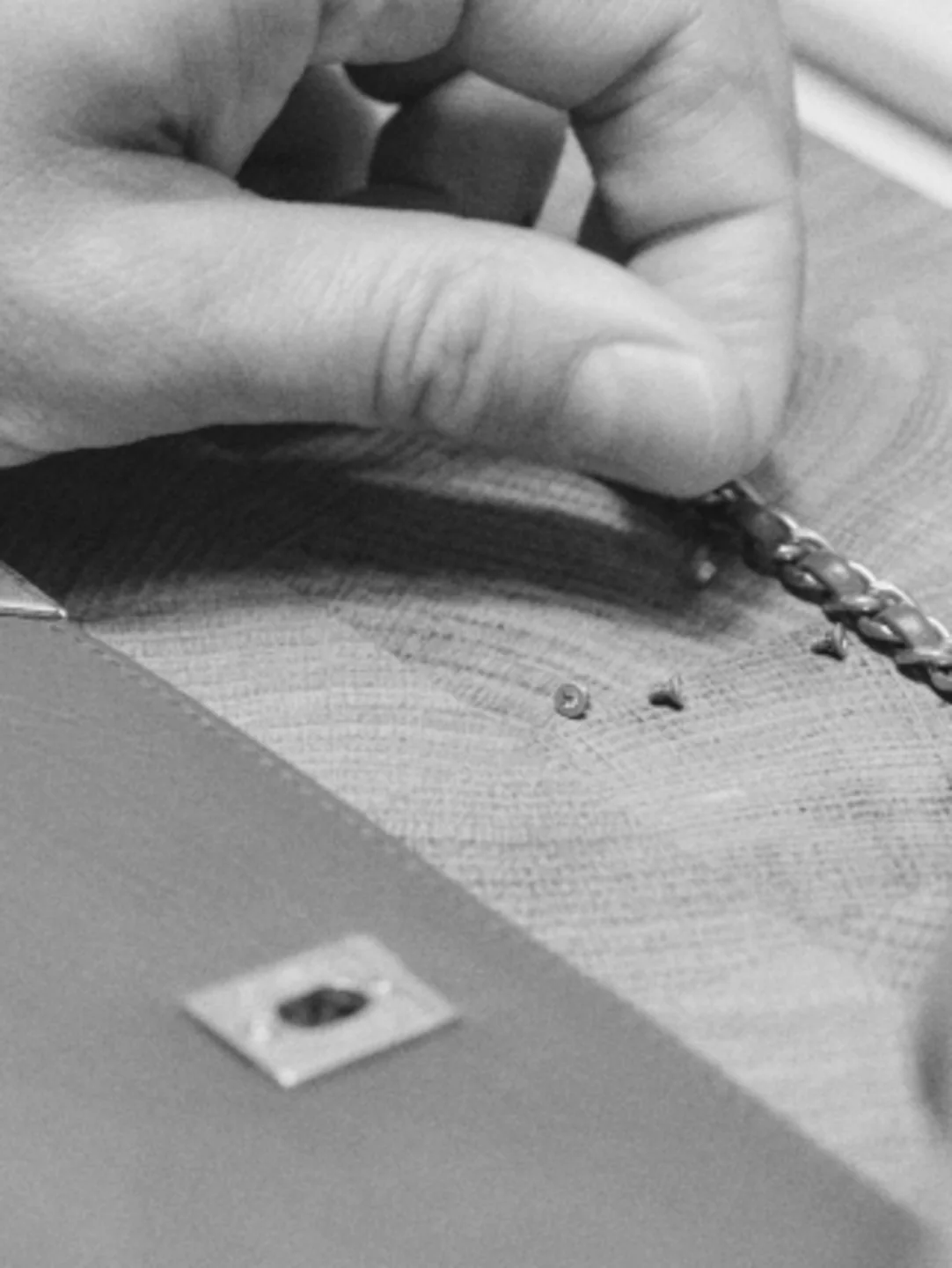 Close view of stitching work in a Chanel atelier