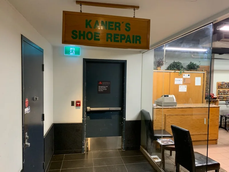 The Kaner’s Shoe Repair sign and lower-level shop entrance