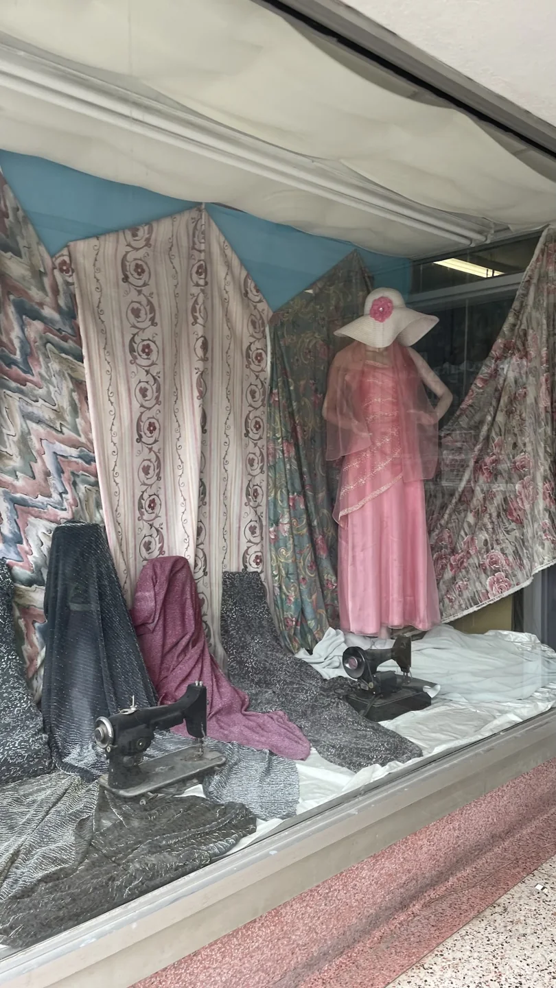 Dresses and fabric displayed in the St. Clair Textiles window