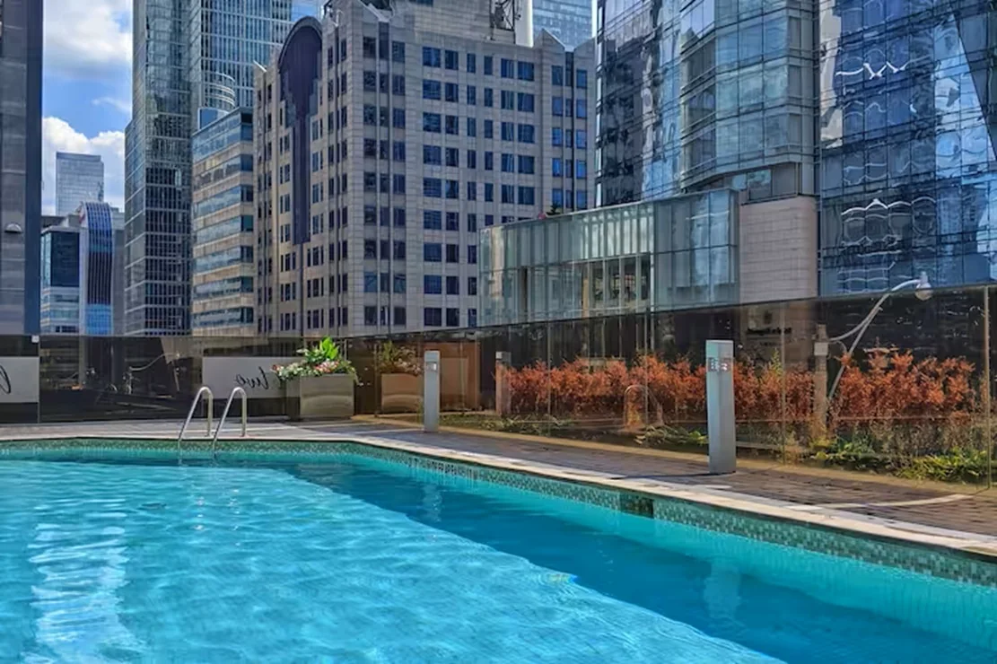 Hilton Toronto’s outdoor pool between downtown buildings