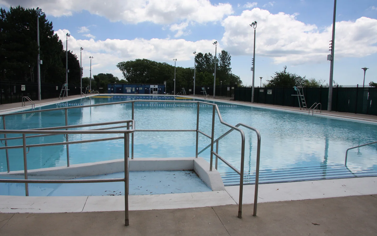 Sunnyside Gus Ryder Outdoor Pool with railings beside the water