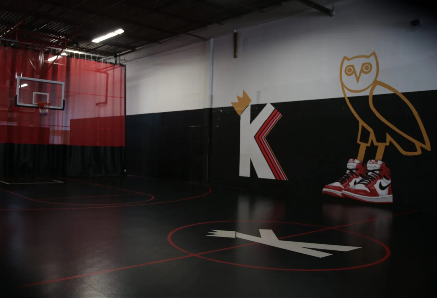 Black and red basketball court with a Kings Courts wall graphic in Scarborough