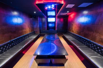 A private room at Bar+ with purple and blue lighting