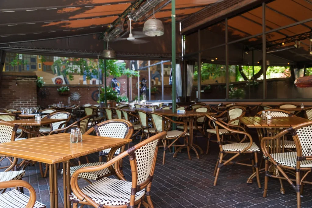 Covered tables and chairs on Granite Brewery’s back patio