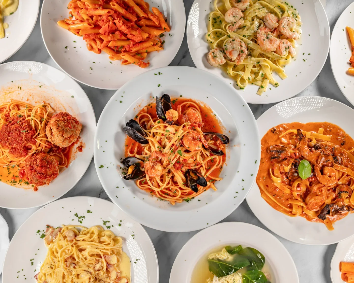 Pasta plates in Regina Pizzeria & Trattoria’s website photograph