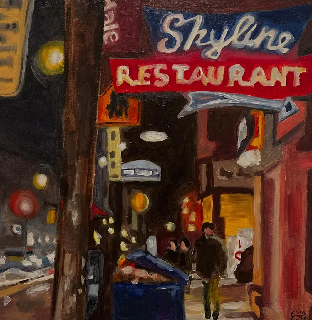 Skyline Restaurant’s illuminated window and entrance at night