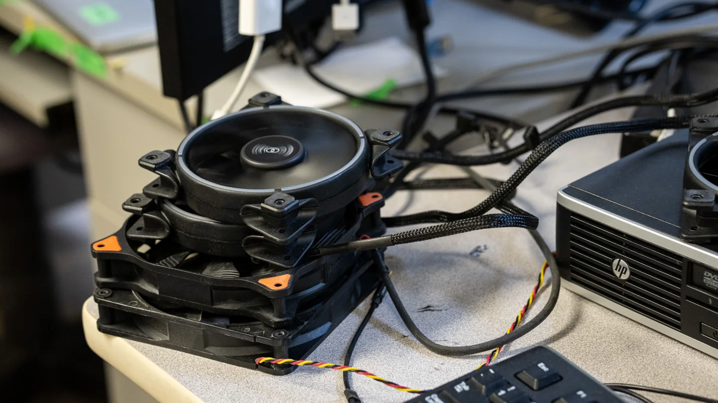 An open computer and cables on a Free Geek Toronto workbench