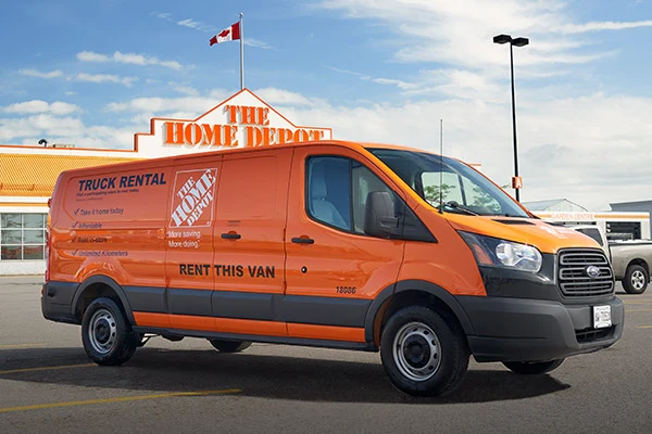 An orange Home Depot rental van outside a Canadian store