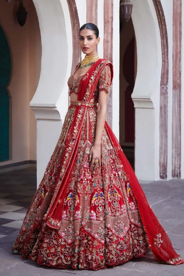 A model wearing Bombay Trendz’s red bridal lehenga