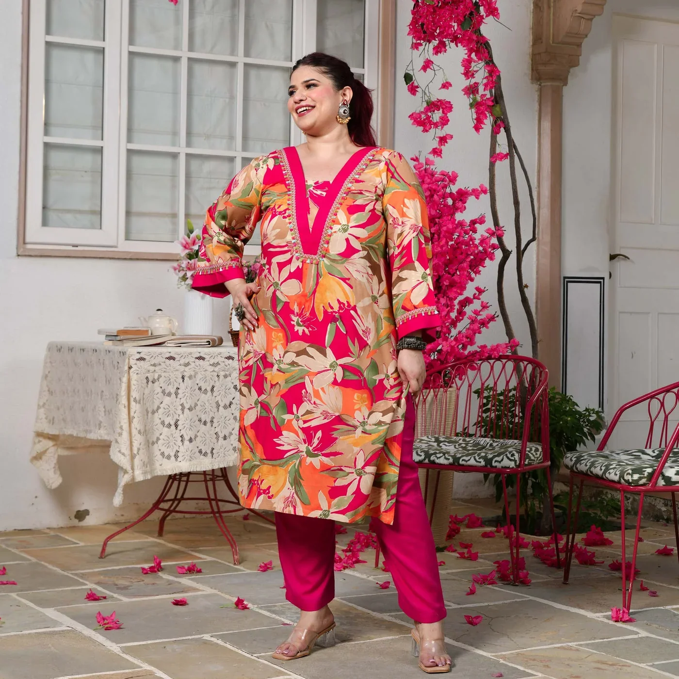A model wearing a pink floral Meera’s kurta