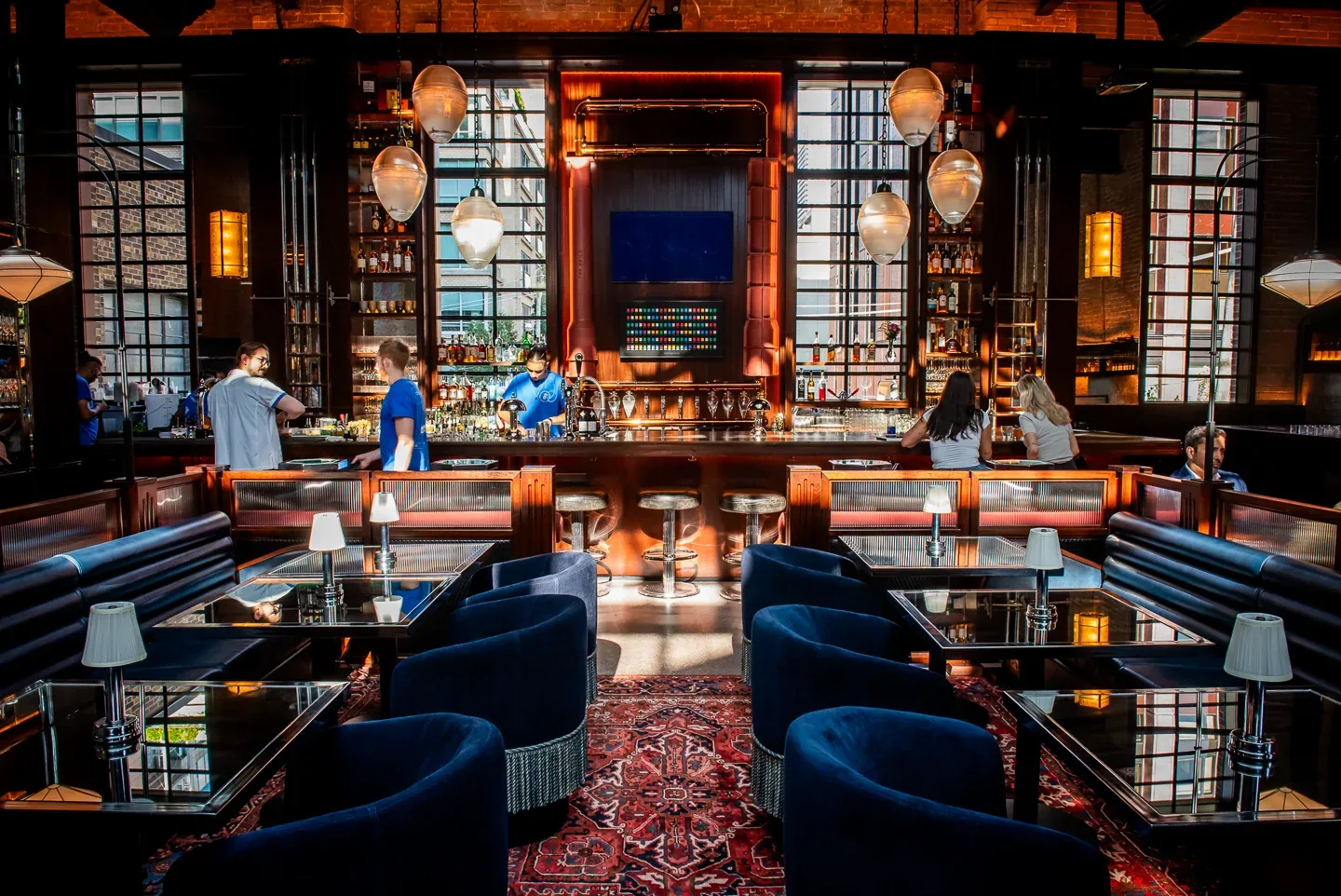 Civil Works bar with blue seating and decorative lights