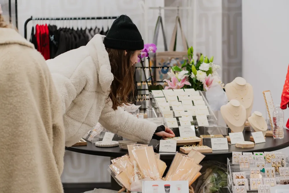 A woman looks at jewellery and gifts at Accent & Co.
