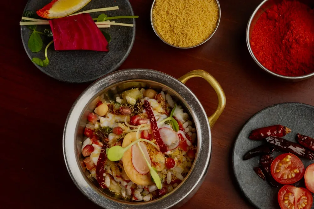 An Indian Street Food Co. dish surrounded by spices