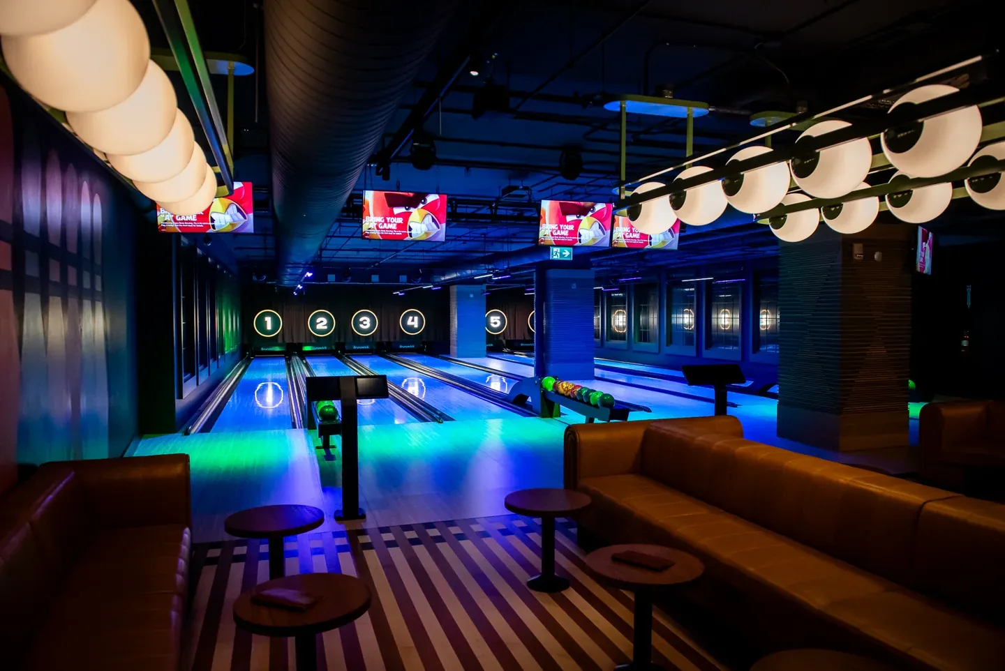 Blue-lit bowling lanes at National