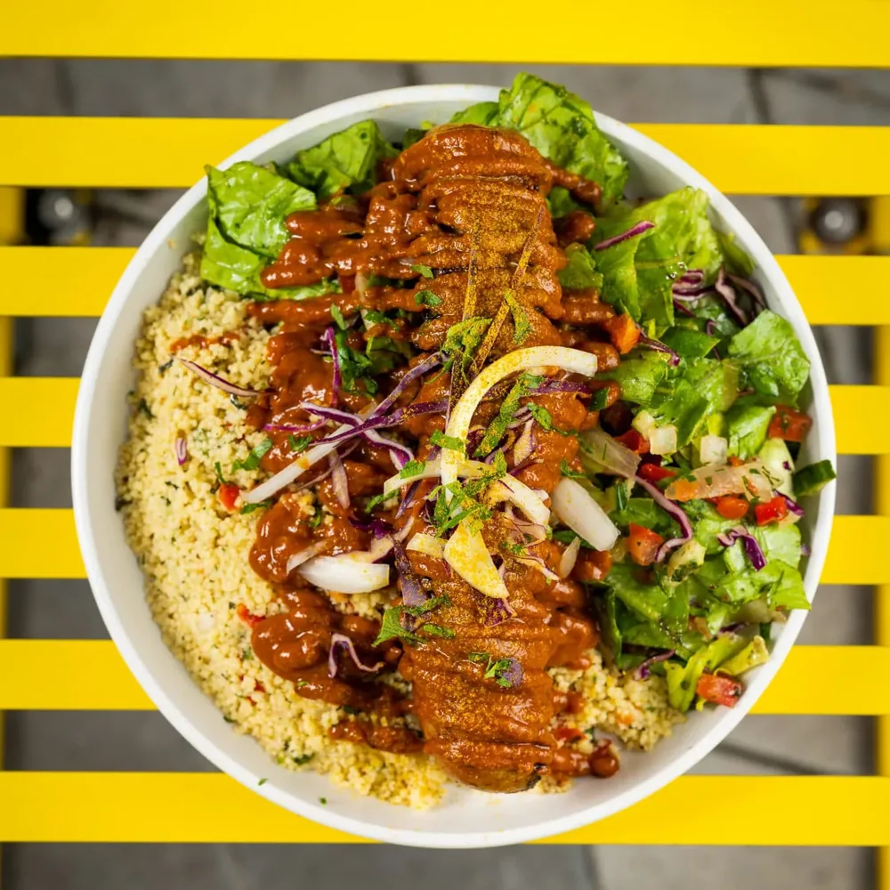 Otto’s food arranged with rice and salad