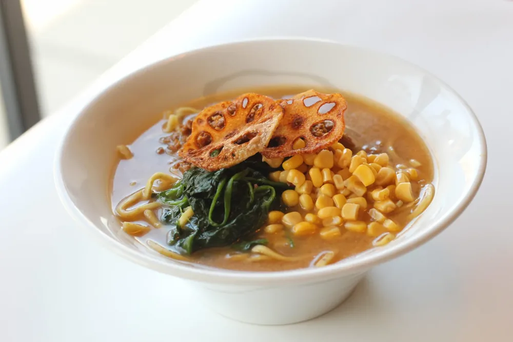 A bowl of ramen topped with vegetables from Ramen RYU