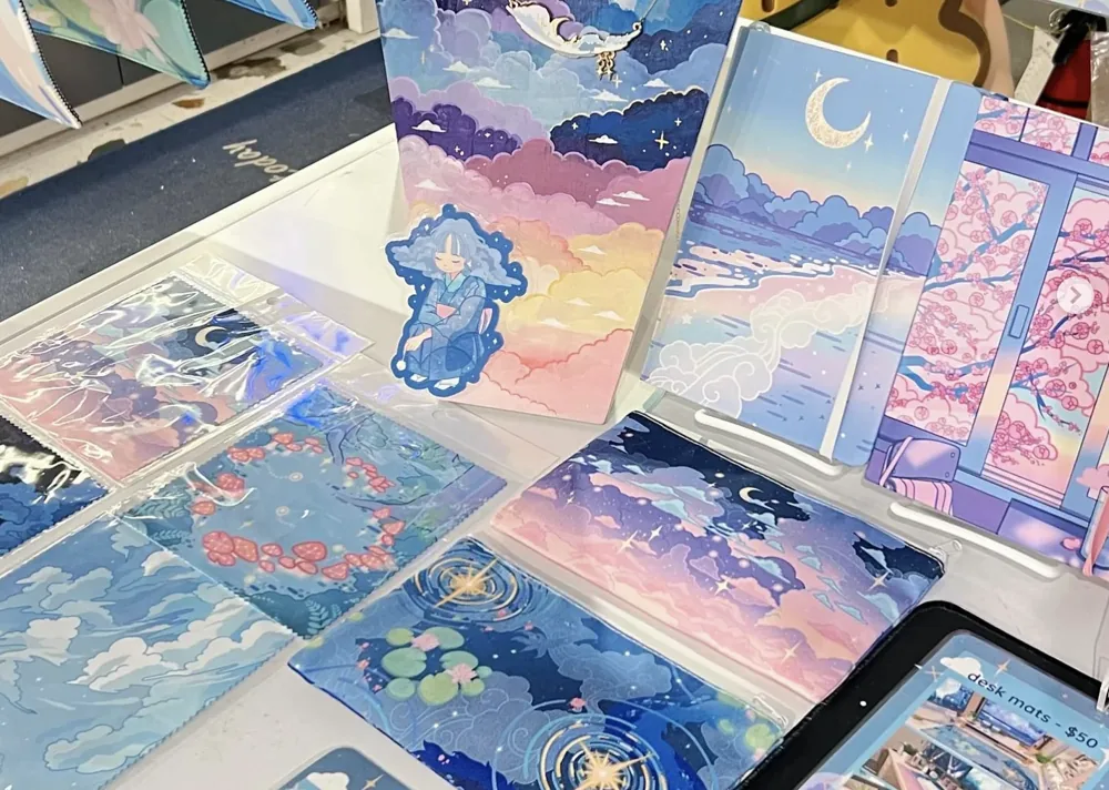 Illustrated cards and artwork displayed at Mr. Surprise