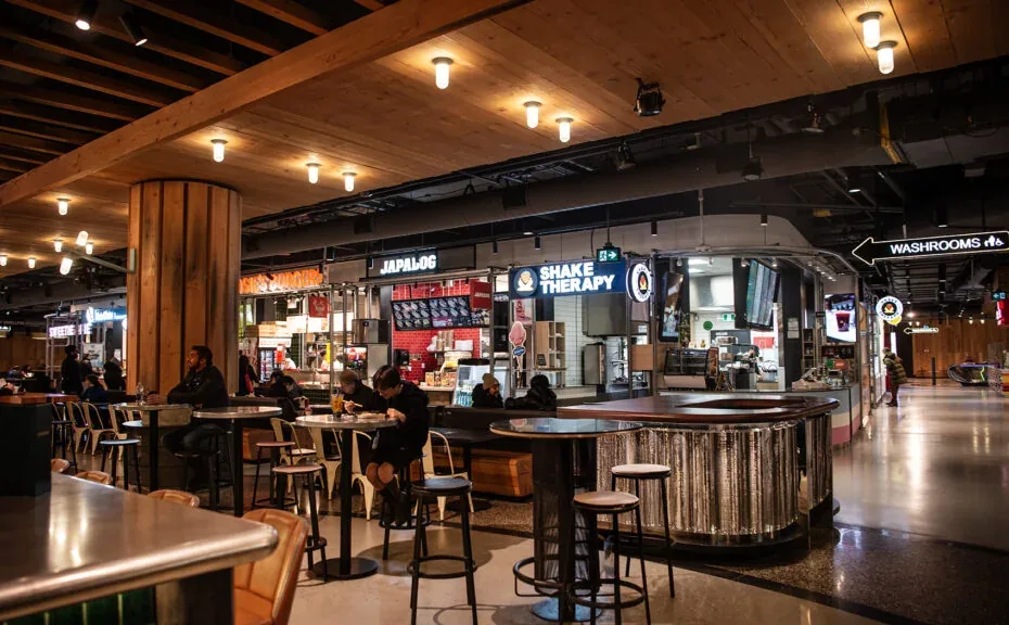 Food counters and shared seating at Wellington Market