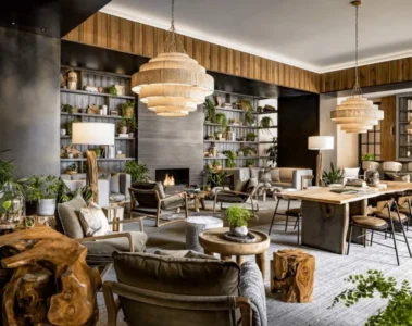 Wood tables, woven lights and green plants in the lobby at 1 Hotel Toronto