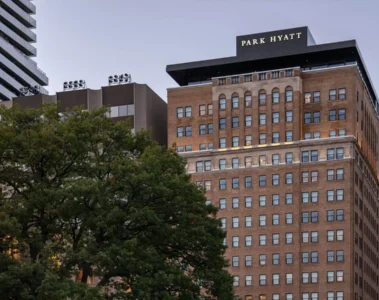 Park Hyatt Toronto on Avenue Road with trees along the street