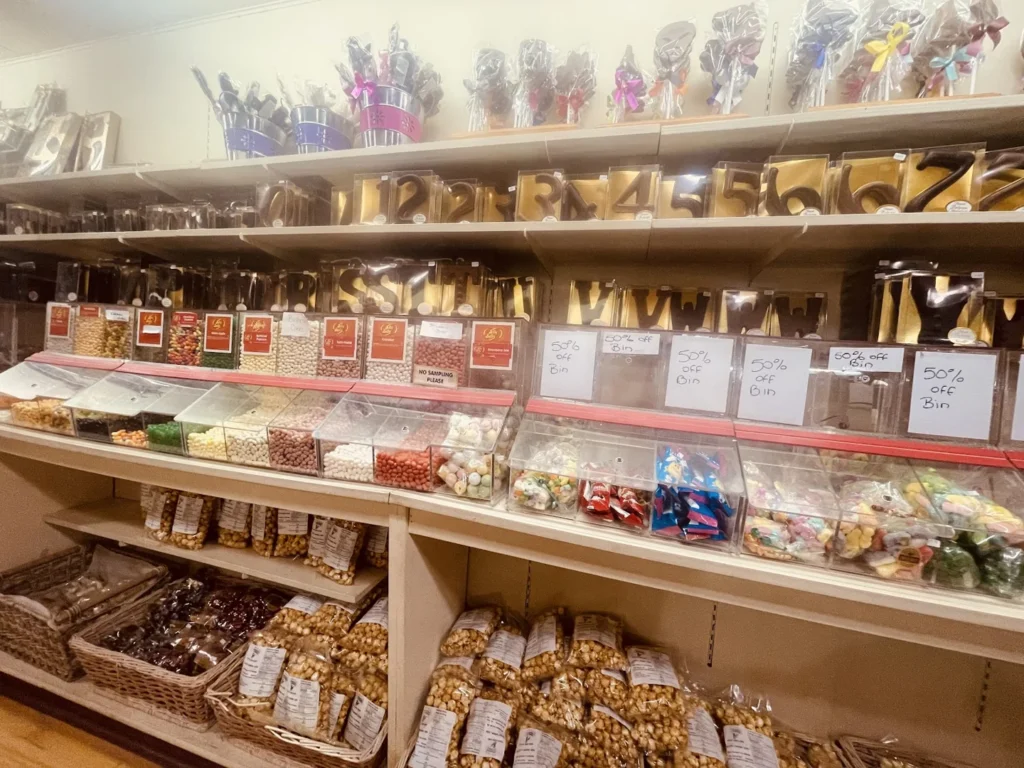 Chocolate letters and bins of sweets at Nutty Chocolatier